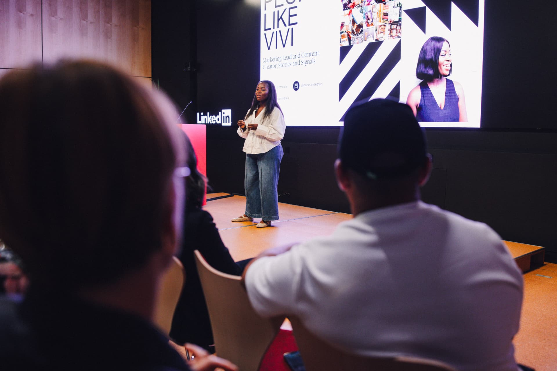 Vivi Koroma Kala speaking on stage at LinkedIn with People Like Us